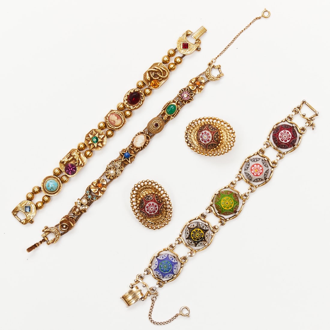 GOLDETTE / GINNIE JOHANSEN - Three Vintage Bracelets and Pair of Earrings (4 pieces): GOLDETTE / GINNIE JOHANSEN - Three Vintage Bracelets and Pair of Earrings (4 pieces) Circle Jewelry Products of New York, USA. 1958 - 1977. Metal. Gold-colored. Rhinestones. Faux stone. Weight: 169. B