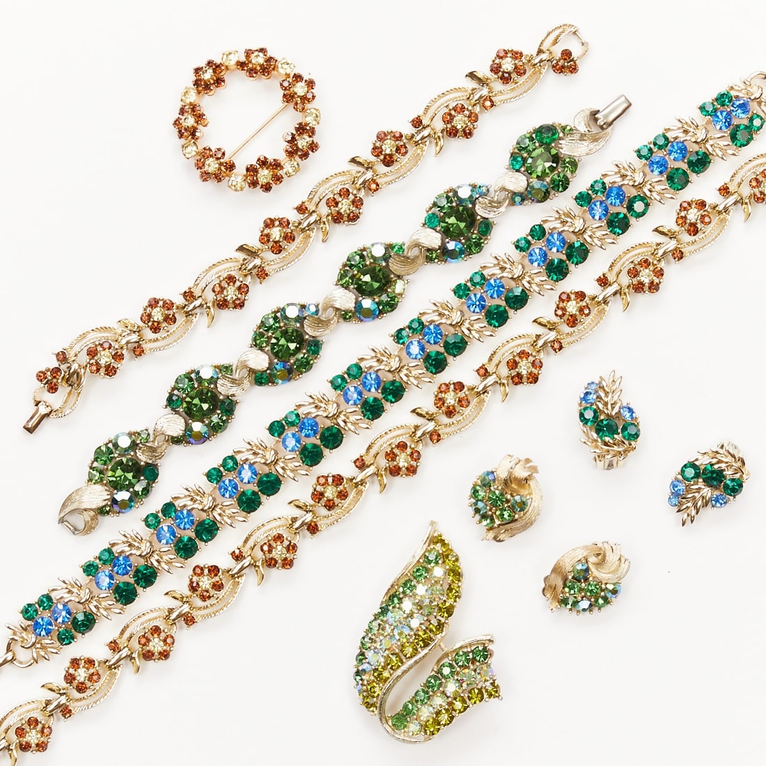 LISNER - Three Vintage Rhinestone Jewelry Sets (8 pieces): LISNER - Three vintage rhinestone jewelry sets (8 pieces) 2 necklaces, 2 bracelets, 2 pairs of ear clips, and 2 brooches. Lisner, New York, USA, circa 1950 - 1970. White gold-/silver-colored metal, rh