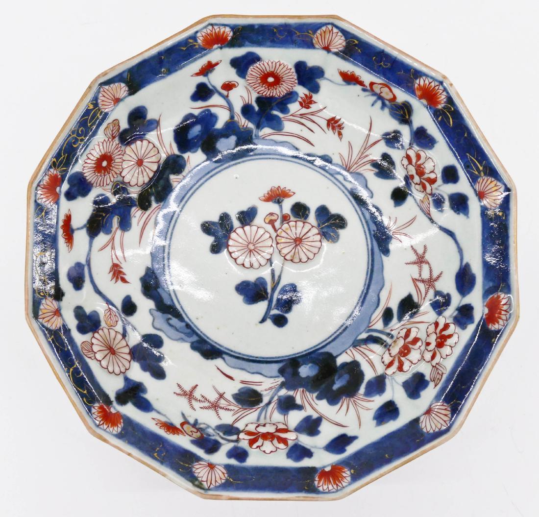 Early Japanese Imari Chrysanthemum Bowl 2''x9.5''.: Early Japanese Imari Chrysanthemum Bowl 2''x9.5''. Faceted form with relief blossoming flowers. Blue underglaze with copper red and gilt overglaze. Light overall wear. 18th century, Edo period. Arita