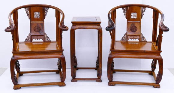 3pc Chinese Huanghuali Horseshoe Chair & Tea Table Set.: 3pc Chinese Huanghuali Horseshoe Chair & Tea Table Set. A fine set including a pair of haung huali carved armchairs with pierced decorated back panels 39''x26''x21''. Also a matching tea or side table