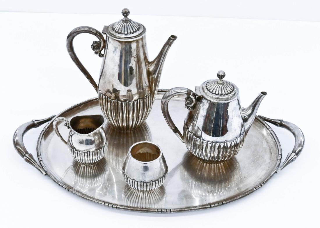 Fine Codan Mexican Sterling Tea & Coffee Service. A: Fine Codan Mexican Sterling Tea & Coffee Service. A heavy modernist hand chased set that includes the service tray 24''x15.5'', a coffee pot 10.5'', a teapot 7.75'', and sugar/creamer set 4''. The set