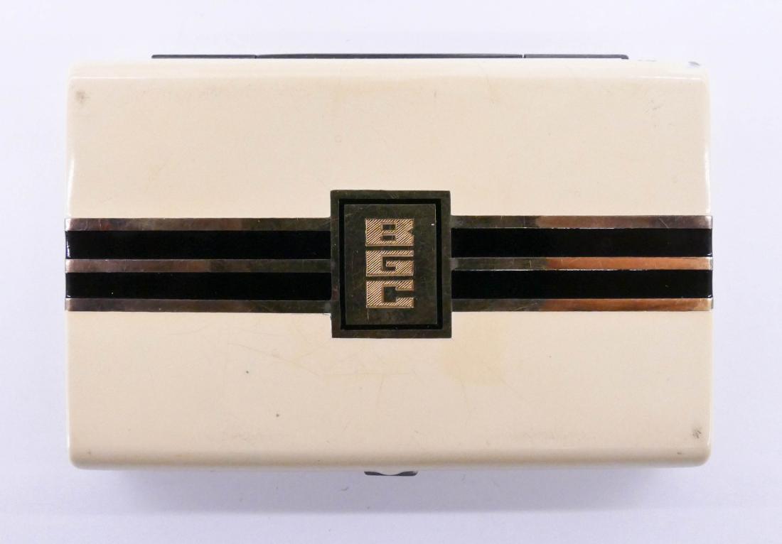 Art Deco Sterling & 14k Enameled Compact 2''x3''.: Art Deco Sterling & 14k Enameled Compact 2''x3''. Slight edge wear to enamel with central ''BGC'' monogram. It weighs 98 grams. Estate jewelry.