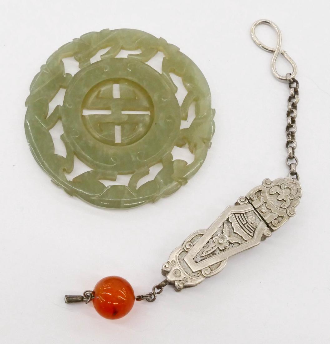 2pc Chinese Jade Prayer Wheel & Silver Toggle. Nephrite: 2pc Chinese Jade Prayer Wheel & Silver Toggle. Nephrite carved jade wheel with rotating center 2.25'' and a silver vase toggle 5.5'' with carnelian bead. Overall light wear. 19th century, Qing dynasty