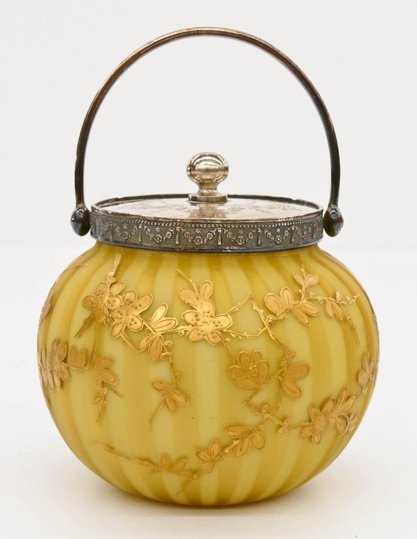 Thomas Webb Yellow Satin Glass Jar 5.5''x4.5''. Gilt: Thomas Webb Yellow Satin Glass Jar 5.5''x4.5''. Gilt decorated with blossoming flowers. Etched silverplated mount with yellow striped satin glass. Excellent condition. Similar to a biscuit or cracker