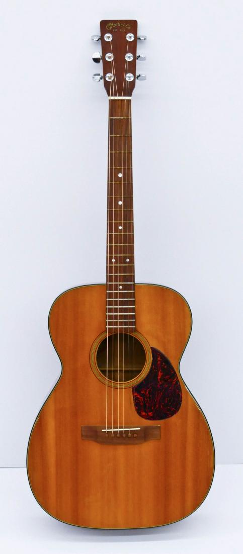 1973 Martin 00-18 Natural Acoustic Guitar Serial Number: 1973 Martin 00-18 Natural Acoustic Guitar Serial Number 338528. Original finish with no cracks. Very light wear from play. Guitar has been electrified by Martin. Fitted hard case by Martin with placar