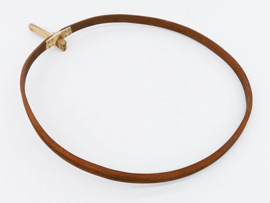 Antique Eskimo Hoop Drum with Figural Handle: Antique Eskimo Hoop Drum with Figural Handle 24.5''x20''. An early hand made native instrument made of bentwood and bone. Figural human face handle 5.25'' inlaid with bead eyes. Light wear from use. M