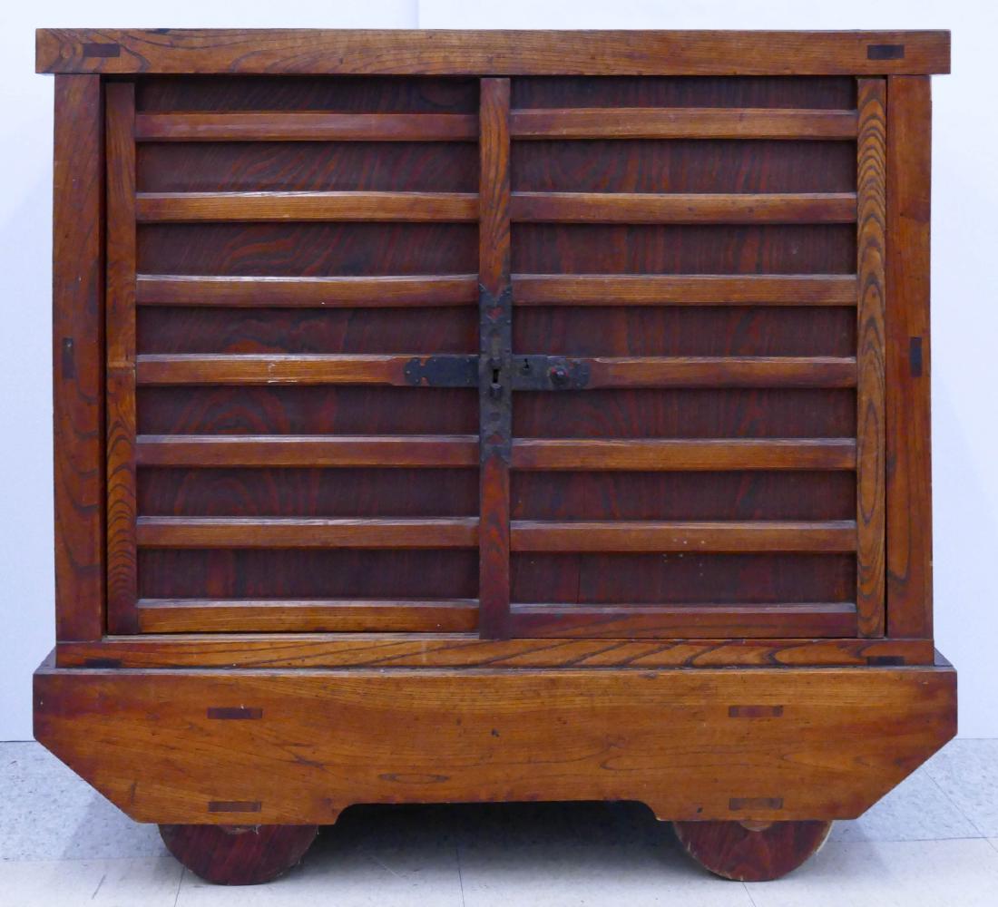 Japanese Karuma Dansu Wheeled Chest 36.5''x39''x20.5''.: Japanese Karuma Dansu Wheeled Chest 36.5''x39''x20.5''. An early tansu chest with wheels. Sliding doors with interior drawers. Overall wear from use. 19th century, Edo or Meiji period.