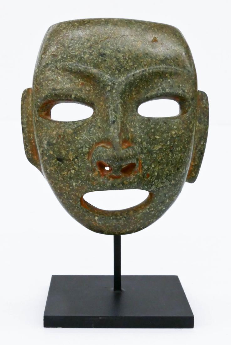 Olmec Stone Maskette on Stand 6''x4''. Finely carved: Olmec Stone Maskette on Stand 6''x4''. Finely carved green stone mask 4.25''x3.75''. Red museum numbering on verso. Overall excellent condition. 1200BCE to 400BCE, Mexico. Ex. Joseph Hirschhorn collec