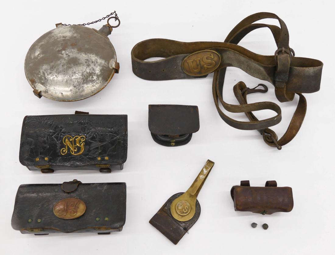 7pc Civil War Field Equipment. Includes a leather belt: 7pc Civil War Field Equipment. Includes a leather belt with US buckle, a brass US leather belt clip, a canteen, two leather NG ammo pouches, leather compass pouch, and a brown leather US ball pouch wi