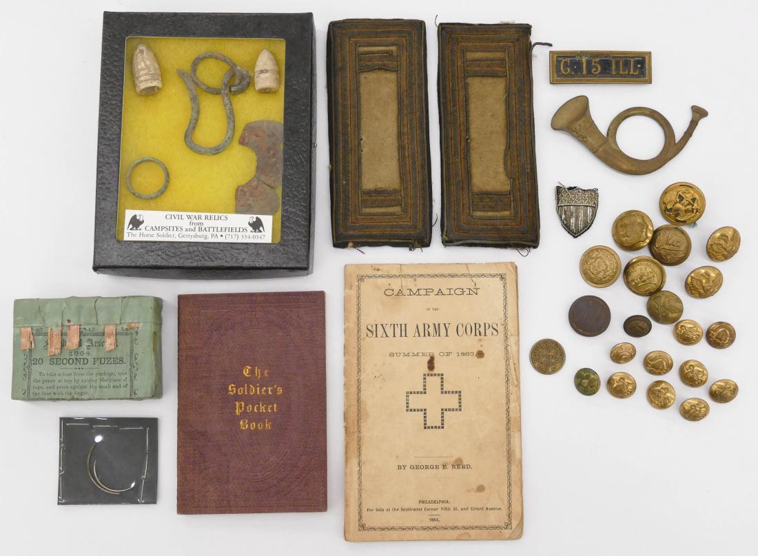 30pc Civil War Buttons, Insignia, & Ephemera. Includes: 30pc Civil War Buttons, Insignia, & Ephemera. Includes twenty various brass coat buttons, a pair of epaulettes, a ''G.15 ILL'' (Illinois) bar pin, a brass horn cap badge, a shield bullion patch, 1863 