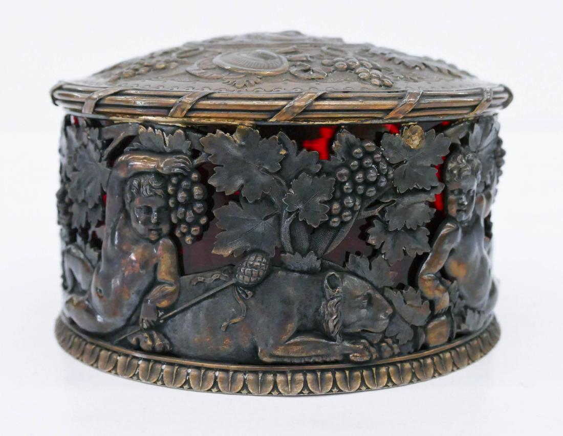 George III Silver Bacchus Covered Box by Benjamin &: George III Silver Bacchus Covered Box by Benjamin & James Smith 3.5''x5.5''. An exceptional Georgian pierced sterling silver box with two panels of opposing putto with reclining lion. Lid has central