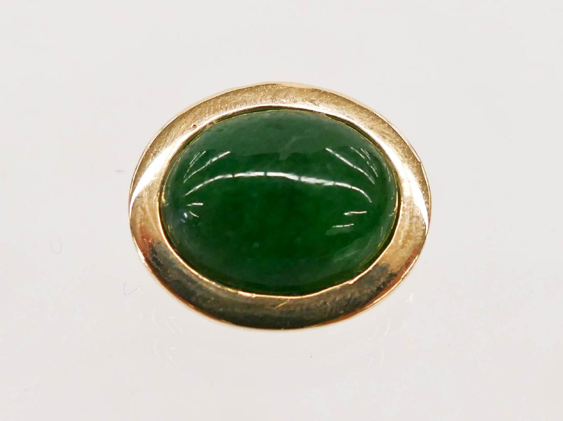 Fine Jadeite 14k Slide Pendant .75''x1''. Includes an: Fine Jadeite 14k Slide Pendant .75''x1''. Includes an emerald green jade cabochon of 13x17mm approx. Set in fourteen karat with two bar slide mount. It weighs 10.4 grams total. Excellent condition. Mi