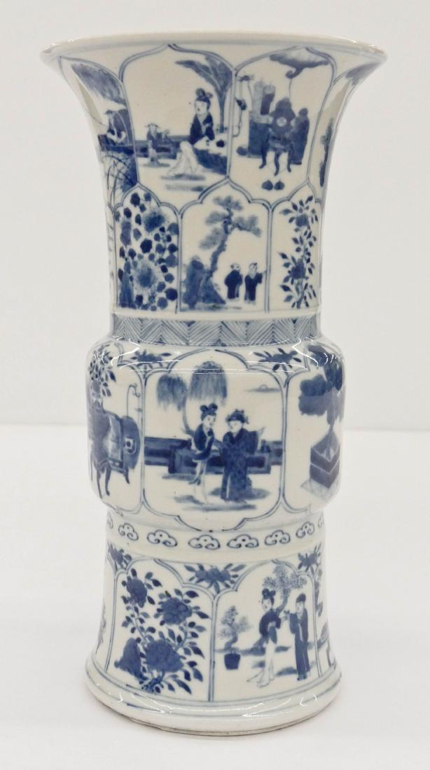 Chinese Blue & White Gu Beaker Porcelain Vase: Chinese Blue & White Gu Beaker Porcelain Vase 14''x7.5''. Paneled blue underglaze motifs of courtesans and scholars in landscape. Some slight kiln chips to bottom foot, otherwise excellent condition. 