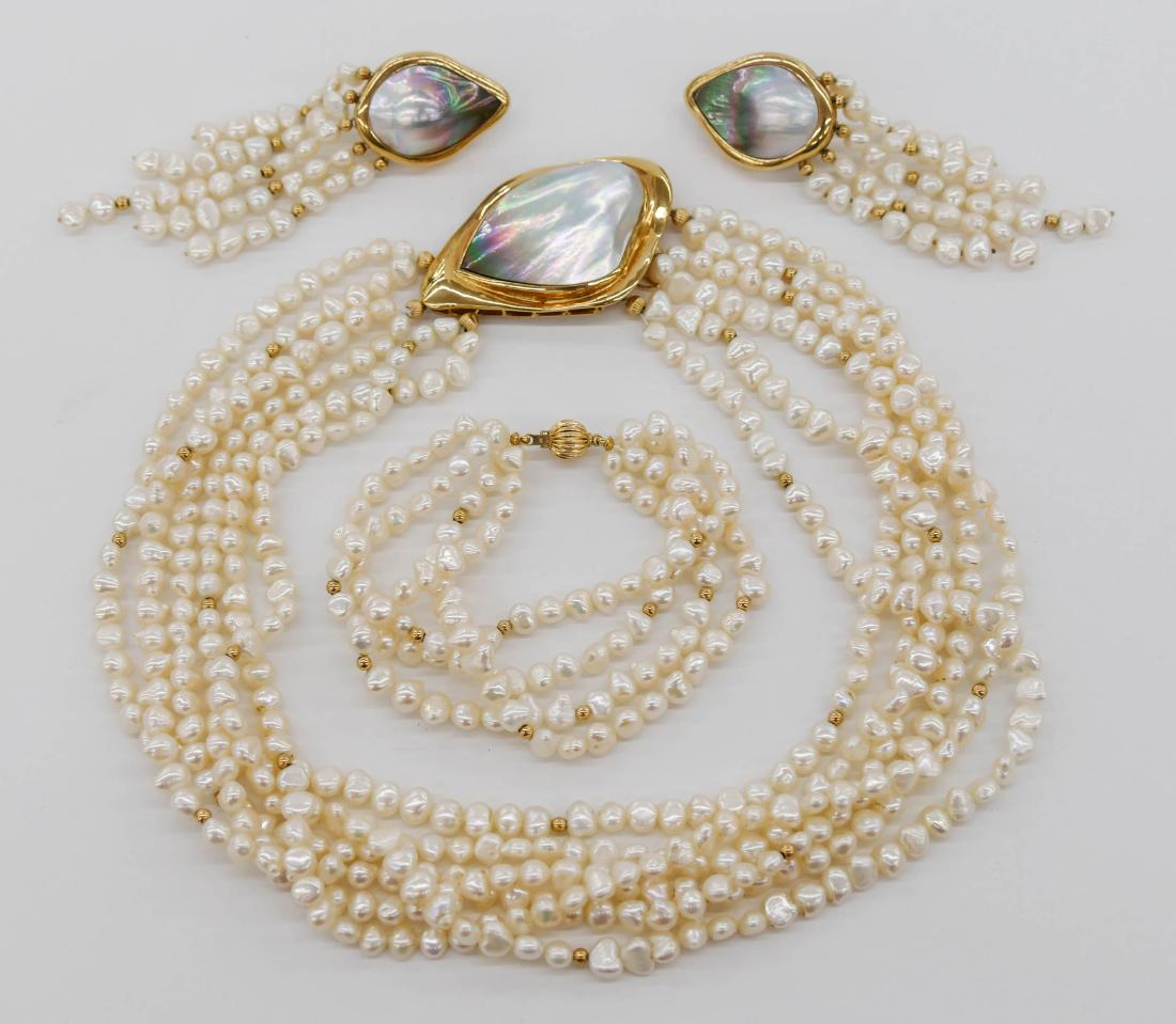 Lady's 14k Designer Freshwater Pearl Jewelry Suite.: Lady's 14k Designer Freshwater Pearl Jewelry Suite. Includes a multi-strand 14'' freshwater pearl and abalone shell clasp necklace. Also a 7'' multi-strand bracelet and a pair of matching dangle abalo
