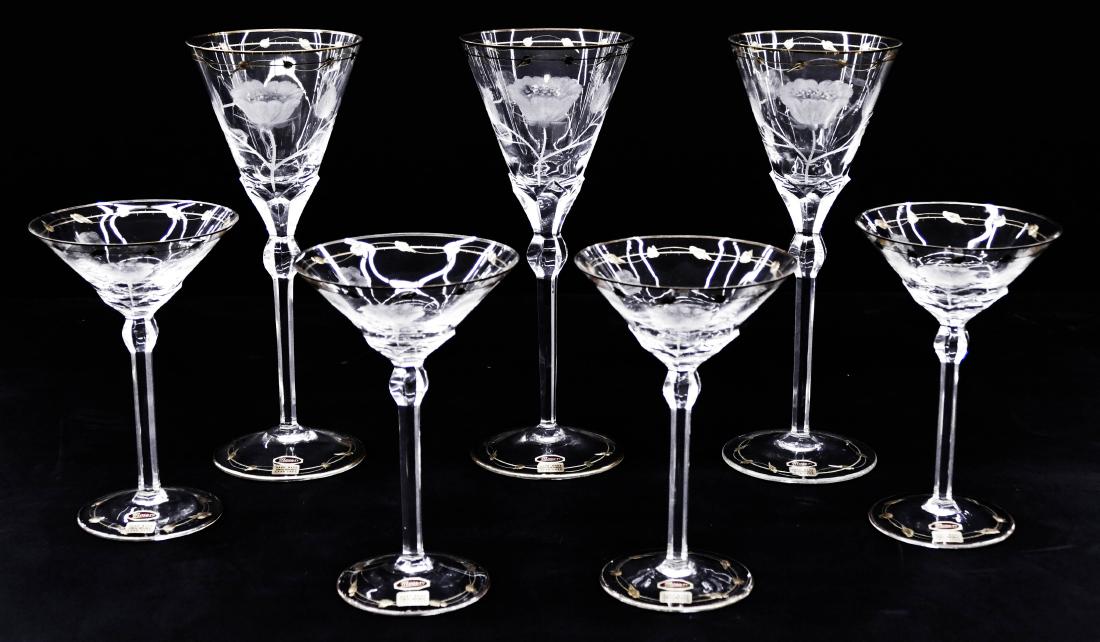 7pc Moser Intaglio Cut Gilt Glass Stemware. Includes: 7pc Moser Intaglio Cut Gilt Glass Stemware. Includes three tall stems with intaglio cut poppy flowers 10.25''x4'' each. Also a set of four martini or white wine stems 6.75''x4.5'' each. Excellent unus