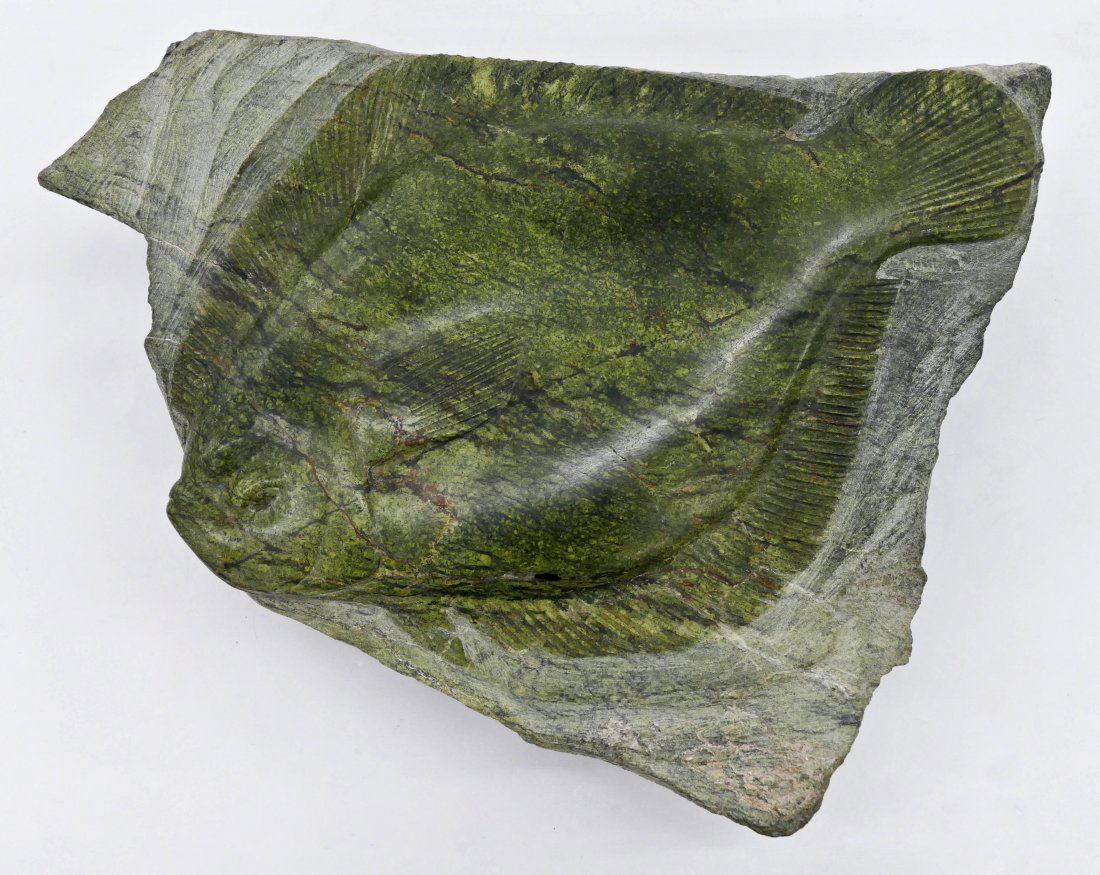 Tony Angell (b.1940 Washington) ''Winter Sole'' Carved: Tony Angell (b.1940 Washington) ''Winter Sole'' Carved Serpentine Sculpture 4''x13''x11''. A low and flat carved stone fish relief sculpture. Signed on side. Purchased Foster/White Gallery, Seattle wi