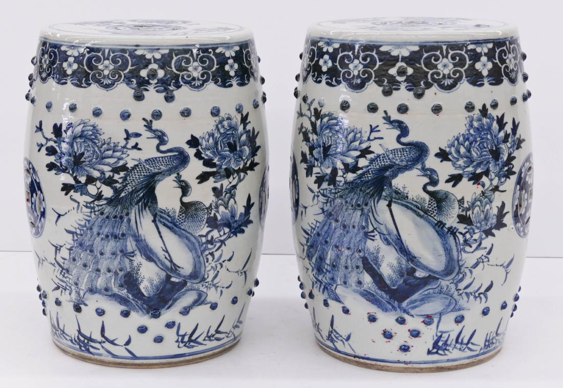 Pair Chinese Qing Blue & White Porcelain Garden Seats: Pair Chinese Qing Blue & White Porcelain Garden Seats 19''x14'' Each. Impressive true opposing pair with blue underglaze decoration and twin peacock motifs with blossoming flowers. Pierced sides and t