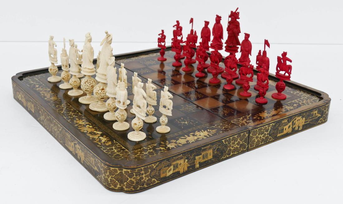Chinese Export Lacquered Chess Game Set 2''x20''x20''.: Chinese Export Lacquered Chess Game Set 2''x20''x20''. A folding gilt lacquered game board box with period carved bone figural chess set. Some slight scattered surface and edge wear from age. 18th cen