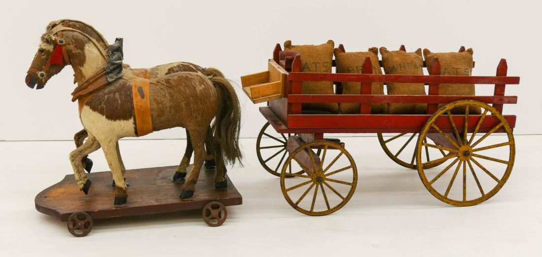 Antique Horse Drawn Wagon Pull Toy 12''x32''x10''.: Antique Horse Drawn Wagon Pull Toy 12''x32''x10''. Impressive hand made twin horse drawn coach with cast iron wheels. Possibly German in manufacture or primitive hand made. Two horses are wrapped in h