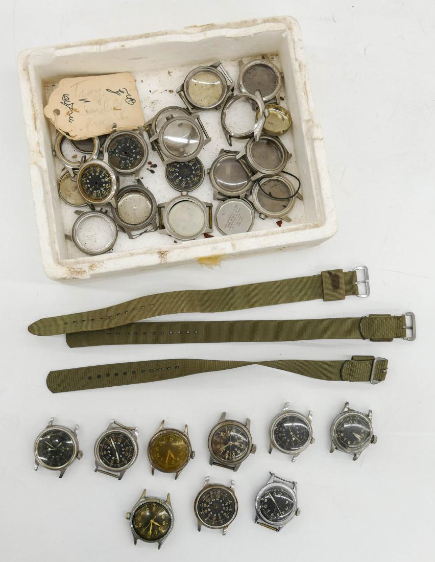 Group of Vintage Military Wrist Watches & Parts.: Group of Vintage Military Wrist Watches & Parts. Includes (12) Hamilton, Bulova, and Elgin watches. Plus a group of empty cases with three green wove bands. None are in working order.