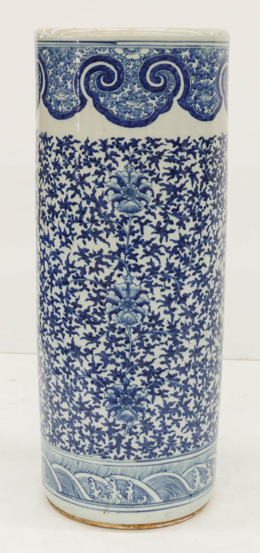Chinese Qing Blue & White Porcelain Umbrella Stand: Chinese Qing Blue & White Porcelain Umbrella Stand 23.5''x9''. Blue underglaze decorated with scrolling lotus flower motifs. Unmarked. Excellent condition with no damage. 19th century, Qing dynasty.