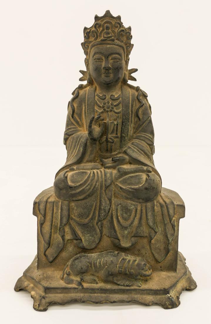 Chinese Ming Bronze Guanyin Seated on Throne 10''x7''.: Chinese Ming Bronze Guanyin Seated on Throne 10''x7''. A seated guanyin with headdress and reclining qilin at base. Scattered surface wear from age. Overall excellent condition. It weighs 2,149 grams.