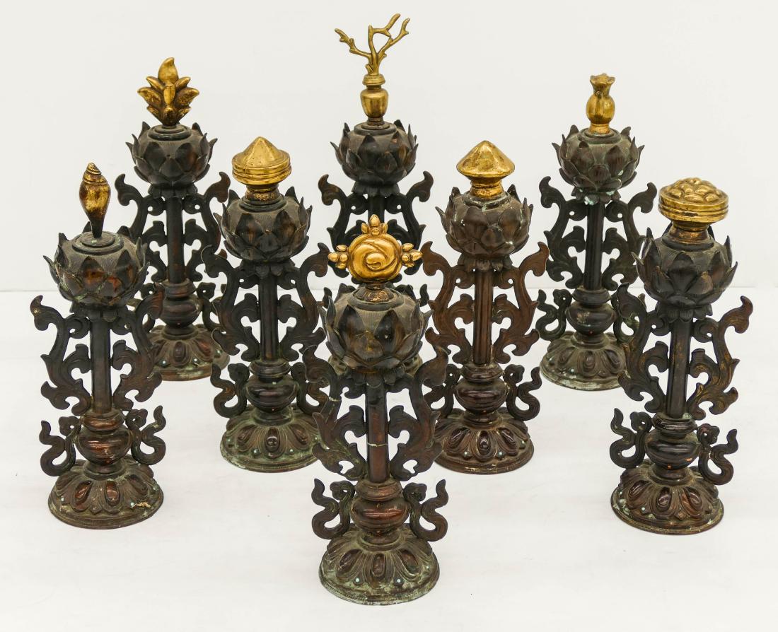 Set of Tibetan Gilt Bronze Buddhist Altar Pieces. An: Set of Tibetan Gilt Bronze Buddhist Altar Pieces. An impressive set of altar instruments with the ashtamangalas or eight auspicious ornaments of the Buddha. Decorated bronze statues of blossoming lotu