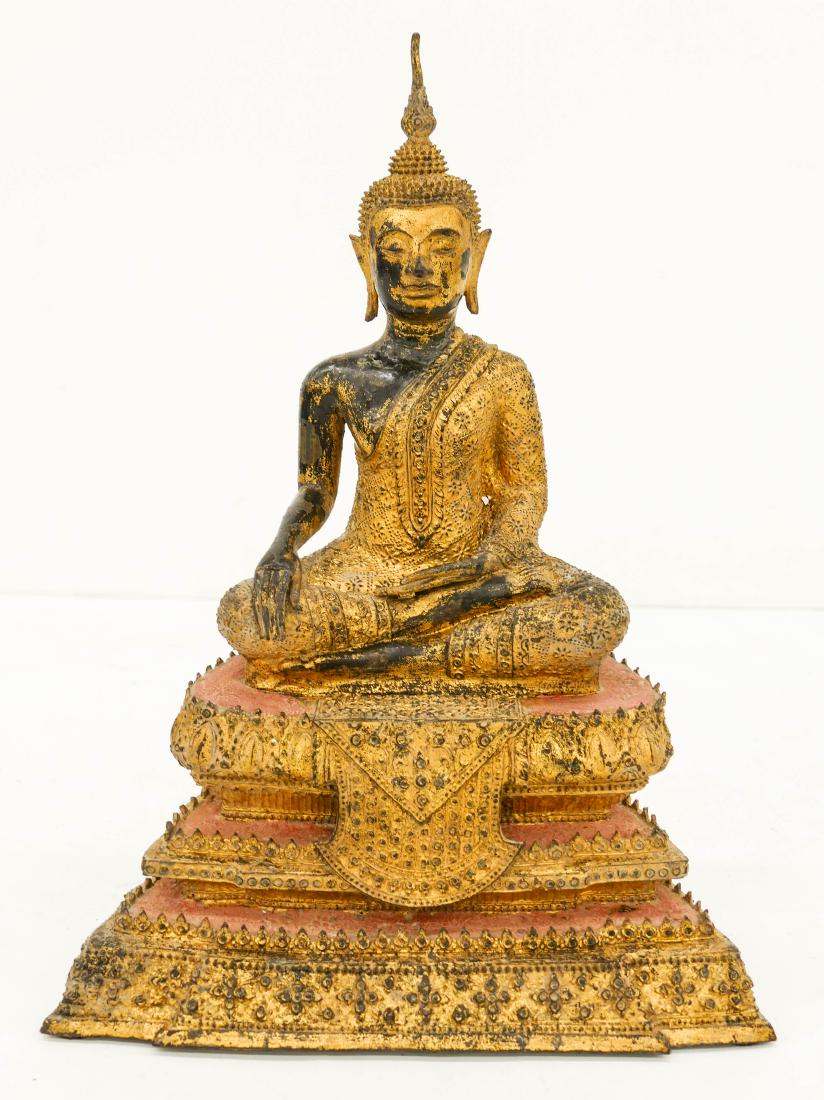 Thai Gilt Lacquered Bronze Seated Buddha 12''x9''. A: Thai Gilt Lacquered Bronze Seated Buddha 12''x9''. A parcel gilt and red lacquered bronze Rattanakosin buddha on throne. Some scattered light surface wear. Overall excellent condition. 19th century, s