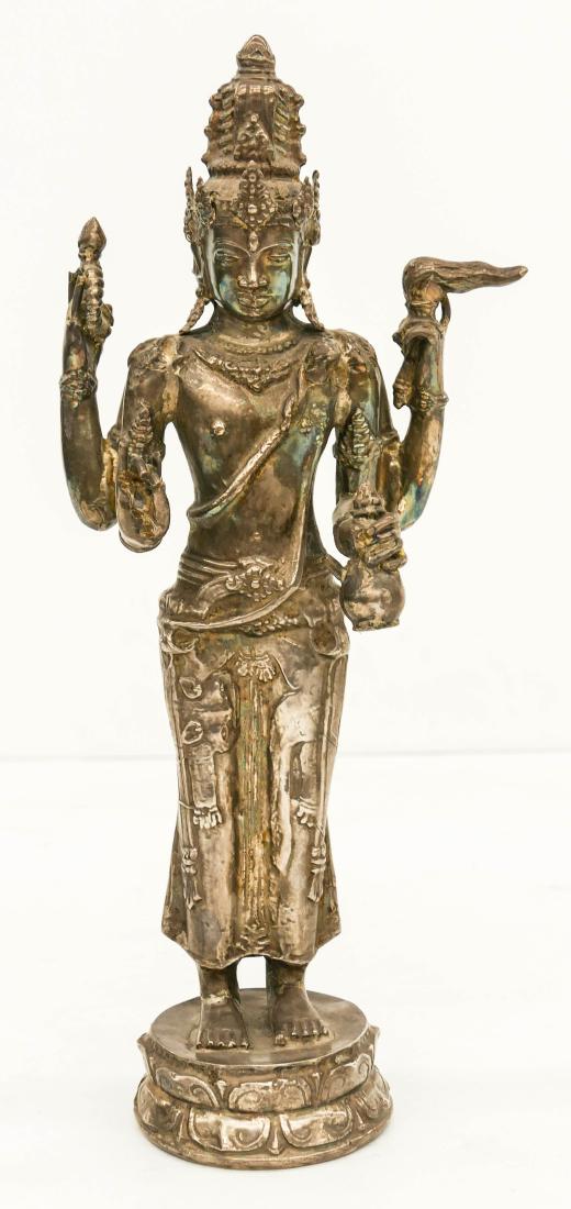 Cambodian Silver Repousse Standing Avalokiteshvara: Cambodian Silver Repousse Standing Avalokiteshvara 12''x5''. A hollow cast and repousse silver standing bodhisattva. It tests as 800-900 grade silver and weighs 249 grams. Overall excellent condition.