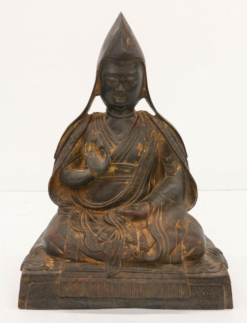 Chinese Parcel Gilt Seated Bronze Buddha 14''x10''. A: Chinese Parcel Gilt Seated Bronze Buddha 14''x10''. A gilt and lacquered seated buddha on throne with inscription on verso. Overall excellent condition. 20th century.