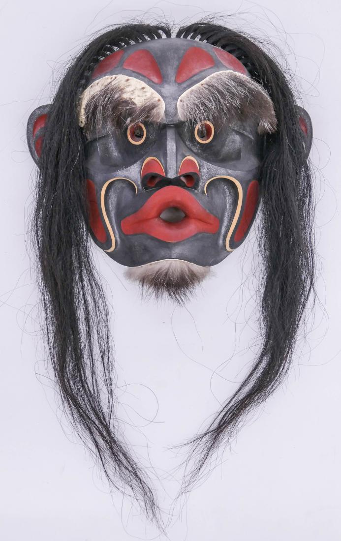 Tony Hunt Jr. (1961-2017 Kwakiutl) Chief's Wild Woman: Tony Hunt Jr. (1961-2017 Kwakiutl) Chief's Wild Woman Mask 1989 Alder 14''x16''x5''. A carved and painted native Dzunukwa mask with fur trim. Signed and titled on verso. Overall excellent condition.