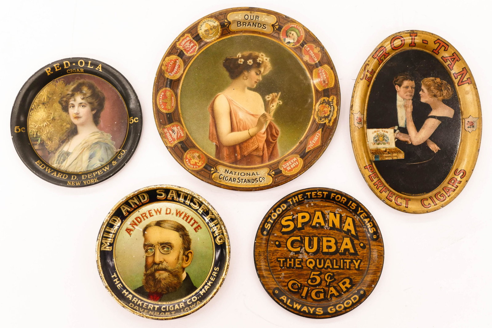 5pc Antique Cigar Tin Advertising Tip Trays. Sizes: 5pc Antique Cigar Tin Advertising Tip Trays. Sizes range from 6'' to 4.25'' diameter. Includes National Cigar Stands Co., El Roi-Tan Perfect Cigars, Red-Ola Cigar, Spana Cuba Cigar, and Andrew D. Whit