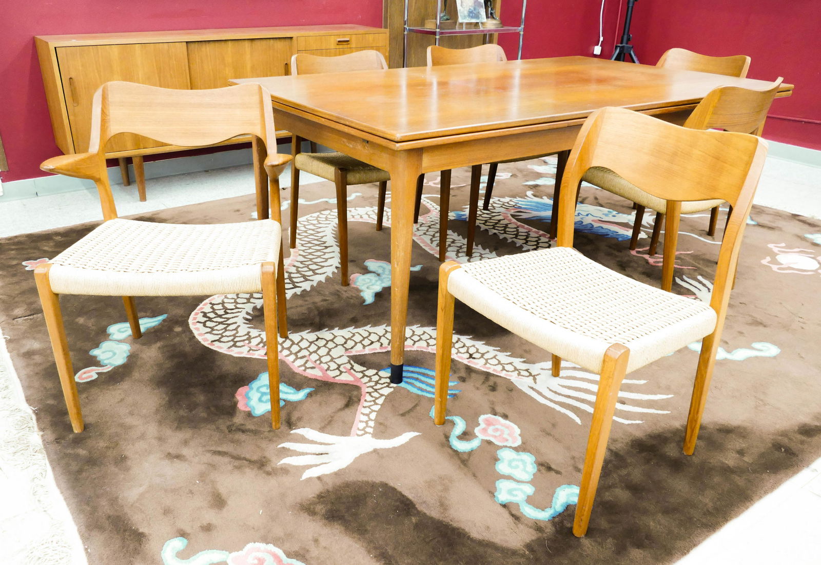 7pc Niels Moller for J.L. Mollers Danish Teak Dining: 7pc Niels Moller for J.L. Mollers Danish Teak Dining Set. Includes a set of six model 71 and 55 teak dining chairs with danish cord seats 31''x19.5''x19'' and 31''x24''x19''. Teak dining table measure