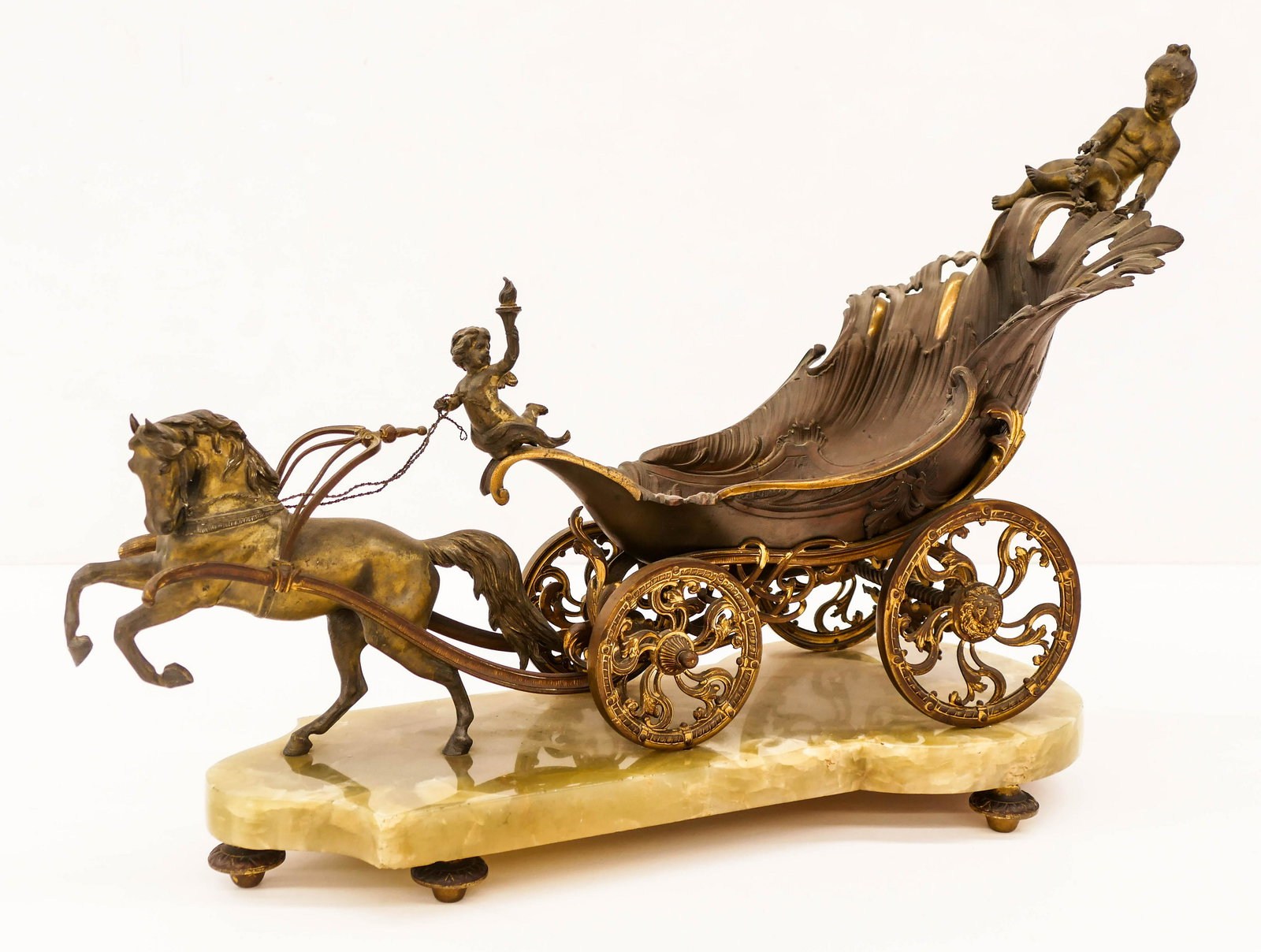 Antique French Rococo Gilt Chariot Centerpiece: Antique French Rococo Gilt Chariot Centerpiece 17''x24''x9''. Impressive gilt metal chariot with putti and wreath. Green onyx base. Scattered surface wear to gilt work. Overall excellent condition.
