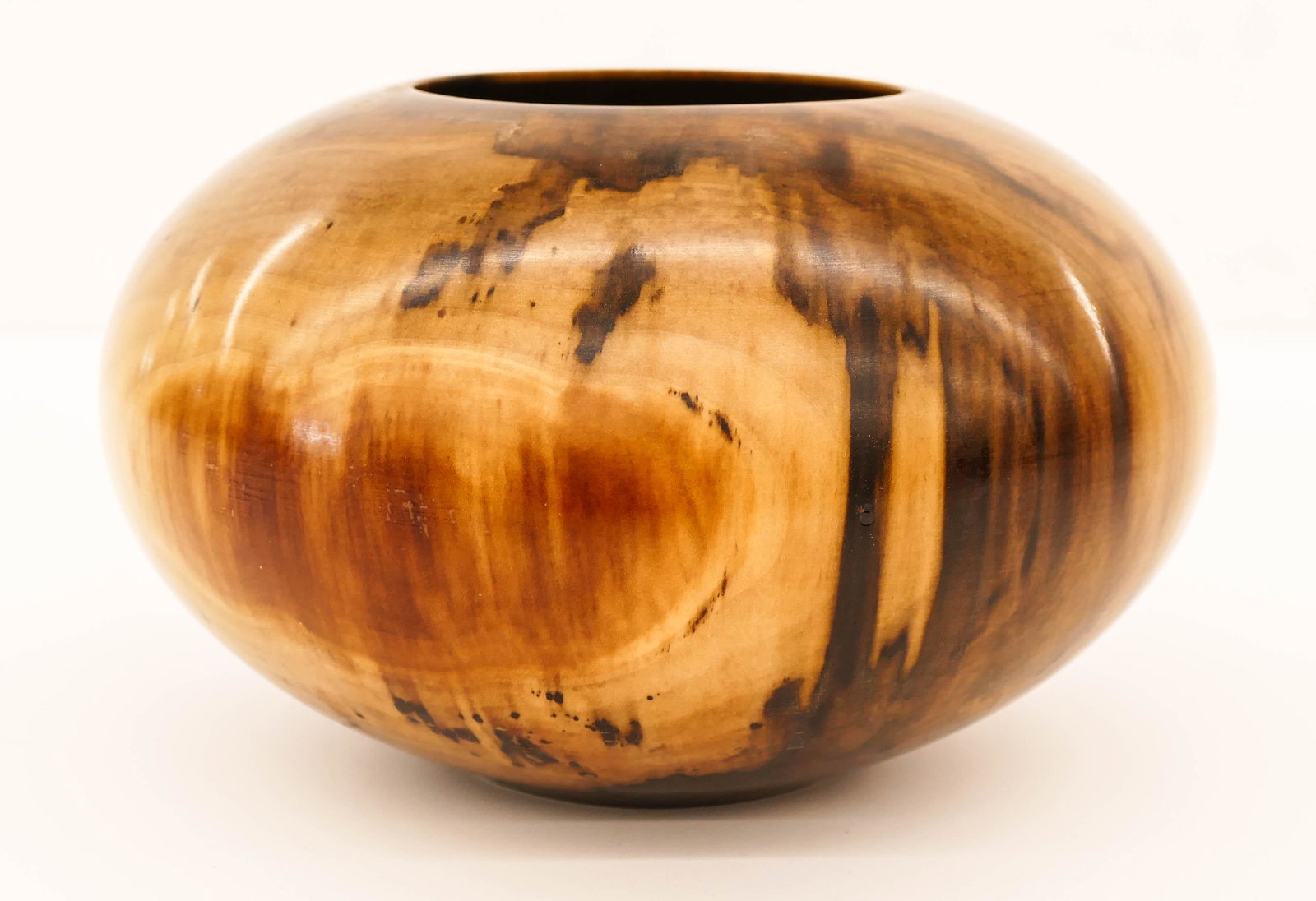 Philip Moulthrop (b.1947 Georgia) Figured Tulipwood: Philip Moulthrop (b.1947 Georgia) Figured Tulipwood Turned Wood Bowl 5''x9''. Signed and numbered 8810 on bottom. Some bubbling to finish on one side, otherwise excellent condition.