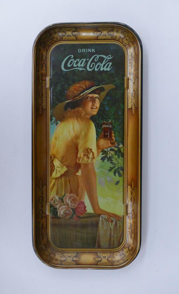 Antique Coca-Cola Elaine Soda Girl Tray: Antique Coca-Cola Elaine Soda Girl Tray. Tray measures 19 x 8.5''. Tray is in overall great condition with some minor wear to edge and craquelure throughout. Estimate: $100-300