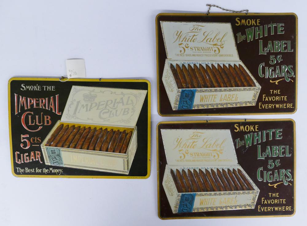 3pc White Label and Imperial Club Cigar Signs: 3pc White Label and Imperial Club Cigar Antique Embossed Tin Hanging Display Signs. Includes 2 White Label 5cent Cigars signs and 1 Imperial Club 5cts Cigar Sign. All signs measure 10x13.75'' and are