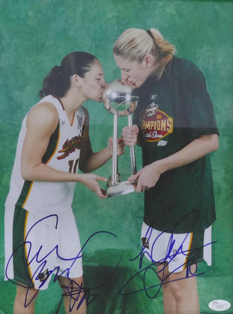 Sue Bird & Lauren Jackson Signed Photograph: Sue Bird & Lauren Jackson Double Signed Seattle Storm WNBA 2004 Championship JSA Certified Photograph. Signed in blue fiber tip marker on fuji photograph. Photograph image is 14x11'' and overall frame
