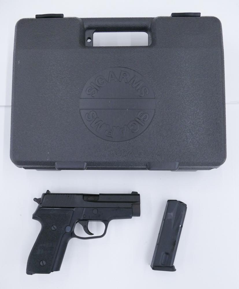 Sig Sauer P228 9mm Semi-Automatic Pistol: Sig Sauer P228 9mm Semi-Automatic Pistol. Serial #B212502. Blue Finish, Fixed Sights, 13 Round Magazine. Kiel Proof Mark and date code KE (1994) on slide chin. Comes with Sig Sauer Hard Plastic Storag