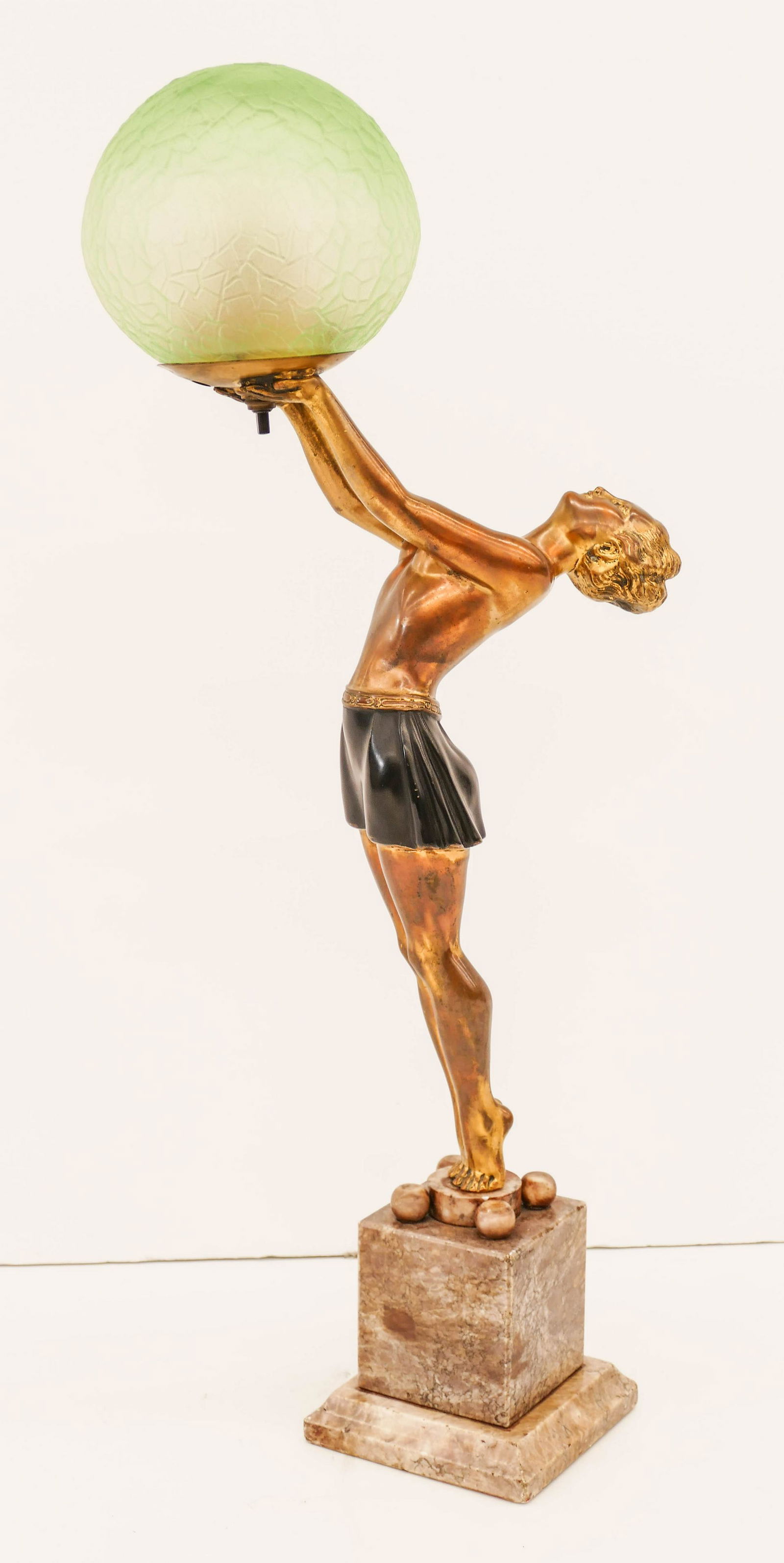 Art Deco Woman with Globe Figural Table Lamp: Art Deco Woman with Globe Figural Table Lamp 22.5''x9.5''. A colored and gilt metal lamp with original green glass globe shade. Alabaster pedestal base. Unmarked, similar to Frankart. Some exterior we