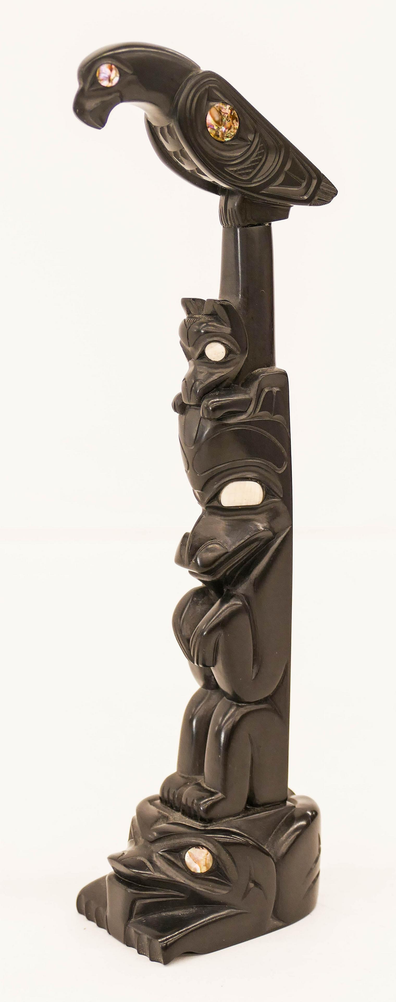 Glen Pollard (b.1957 Haida) Eagle Bear Frog 1987: Glen Pollard (b.1957 Haida) Eagle Bear Frog 1987 Argillite Totem Model 7.25''x2.25''. Impressive Northwest Coast native miniature totem with inlaid abalone eyes. Signed and dated on bottom. Excellent