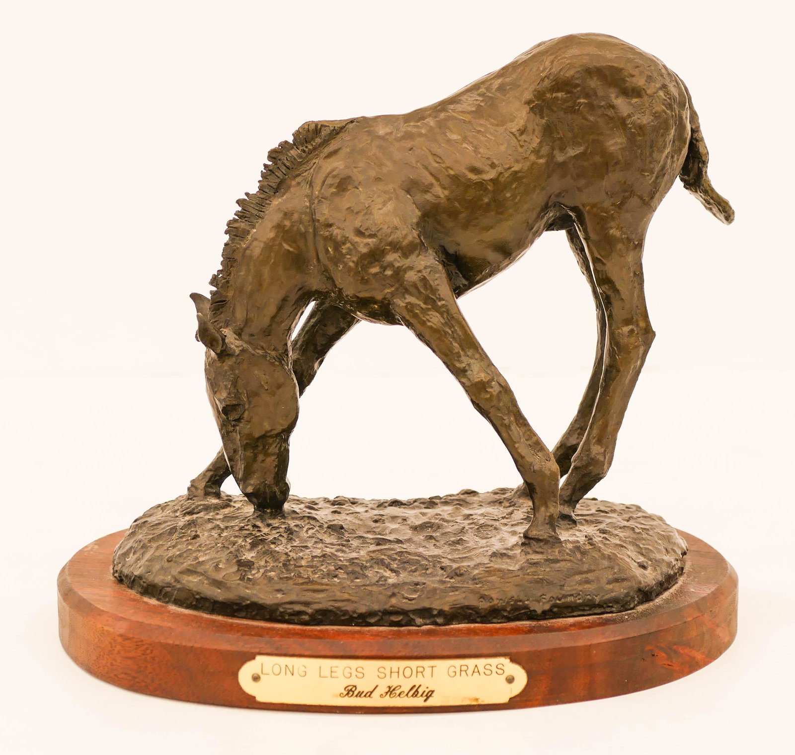 Bud Helbig (1919-2002 Montana) ''Long Legs Short: Bud Helbig (1919-2002 Montana) ''Long Legs Short Grass'' 1977 Bronze Sculpture 7''x8''. A western sculpture of a horse. Signed and numbered 12 of 24 edition with Powell Foundry mark. Excellent conditi