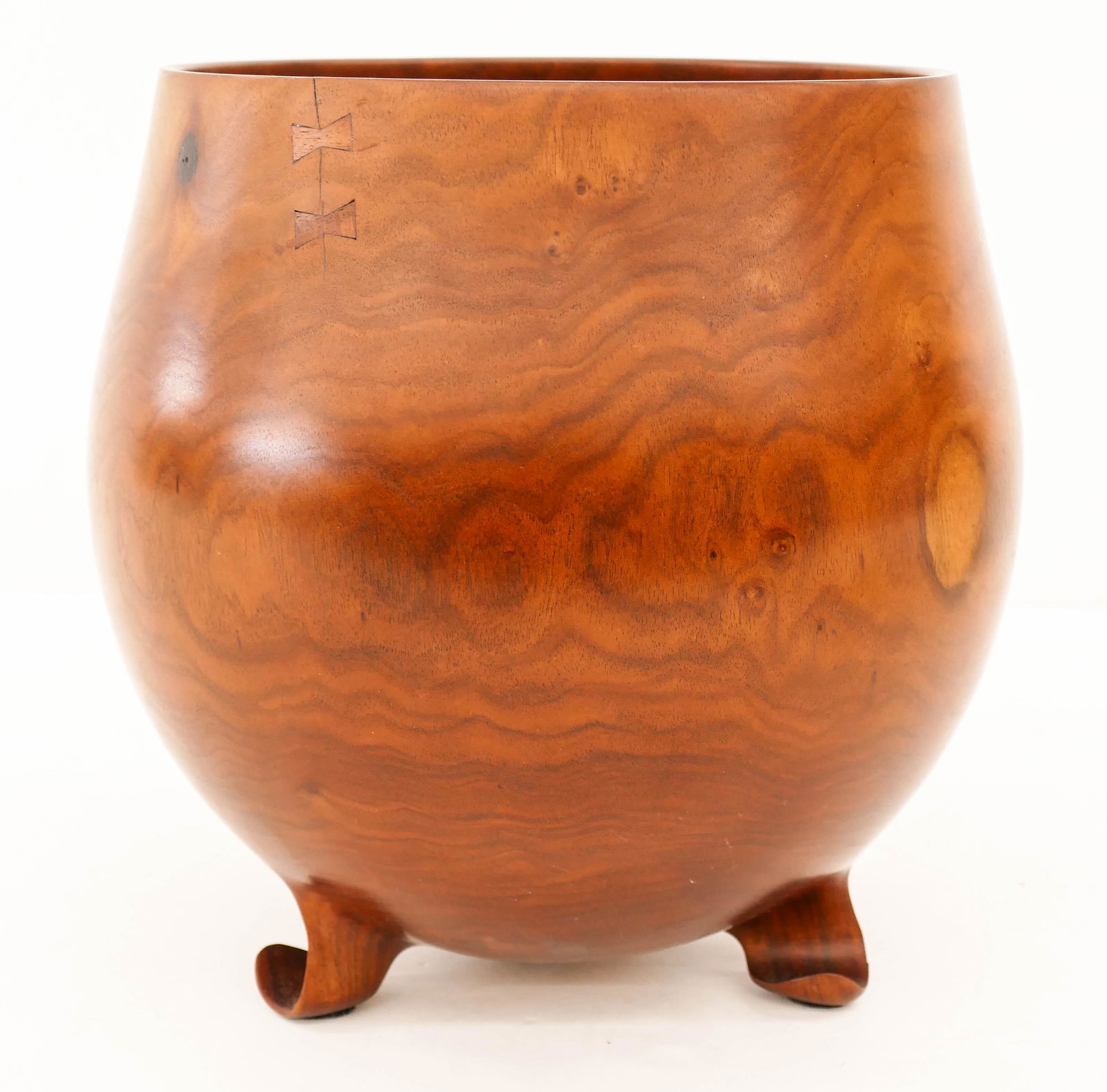 Dennis Hakes Hawaiian Umeke Milo Bowl 10.5''x10.5''.: Dennis Hakes Hawaiian Umeke Milo Bowl 10.5''x10.5''. Impressive turned wood calabash bowl with carved tripod feet. Large butterfly repair to bottom and small butterfly repairs to crack at top rim. Sig