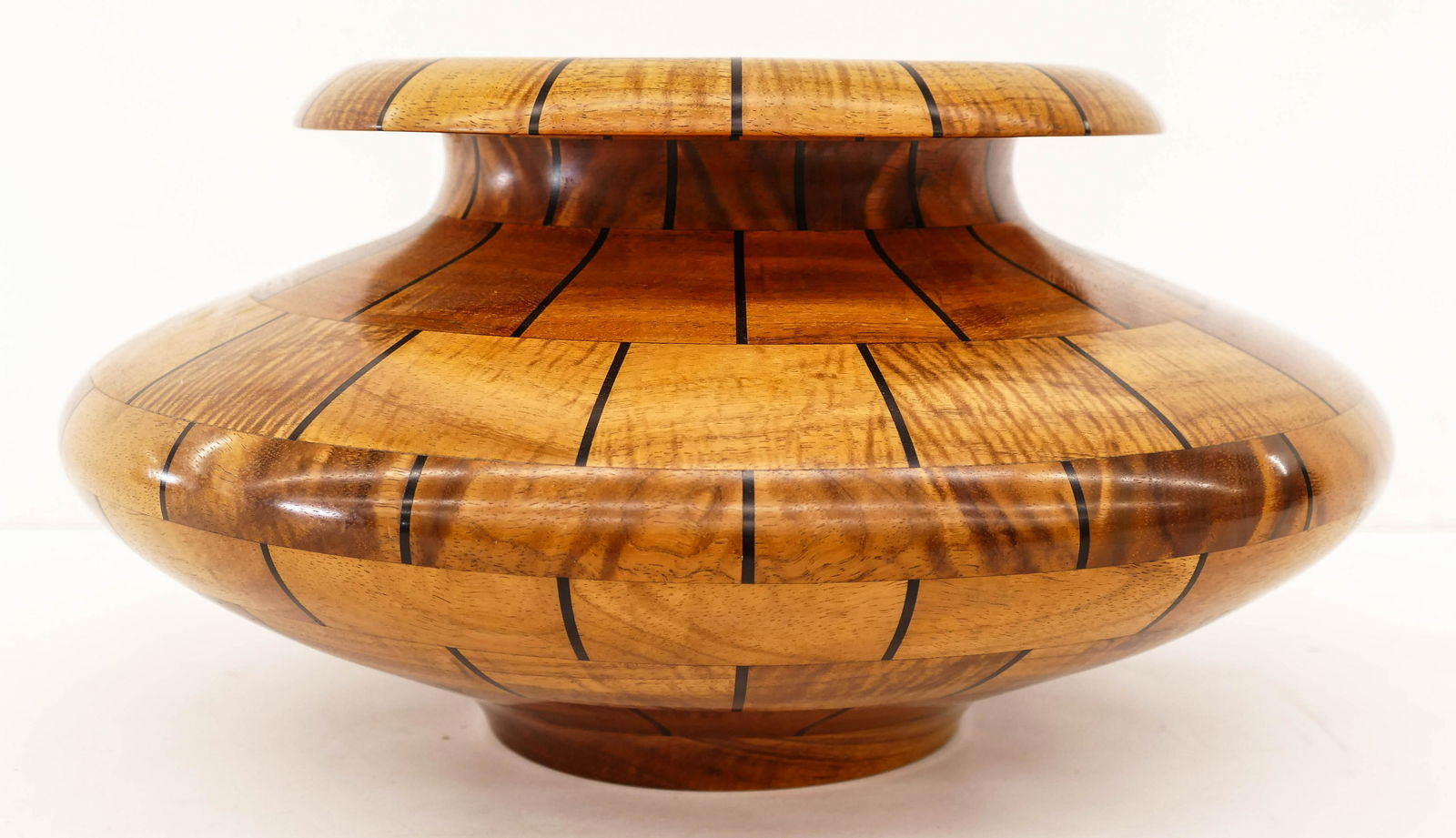 Gregg Smith Hawaiian Koa with Ebony Inlay Squat Vase: Gregg Smith Hawaiian Koa with Ebony Inlay Squat Vase 8''x15.5''. A pieced together and turned wood vessel. Signed and notated Kailua Kona, HI on bottom. Purchased at Martin & MacArthur, Hawaii. Excell