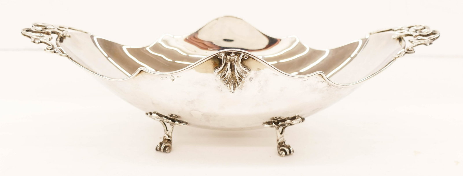 Italian Argento 800 Silver Footed Center Bowl: Italian Argento 800 Silver Footed Center Bowl 3.5''x12.5''. Pierced hanldes and scrolled feet. Hallmarks on side with original foil label on bottom. It weighs 371 grams. Some slight surface scratching