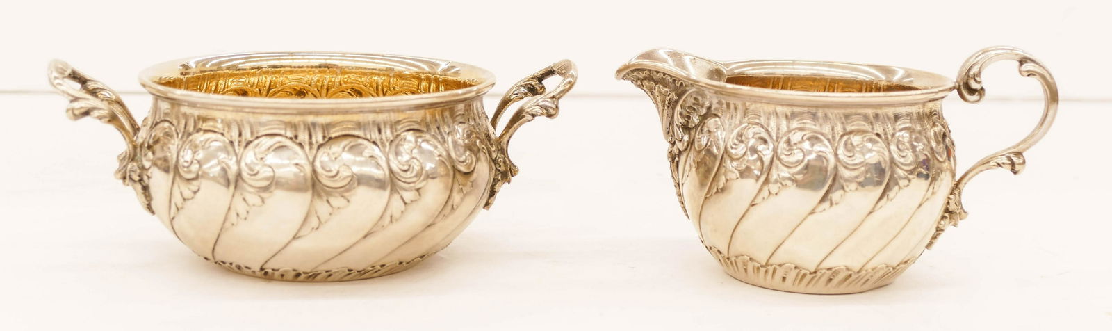 Antique David Andersen Norwegian 830 Silver Sugar and: Antique David Andersen Norwegian 830 Silver Sugar and Creamer Set. A matching repousse sugar 2.25''x5.75'' and creamer 2.5''x4.75''. Clearly marked ''David Andersen Christiania 1894'' on bottom. Set w