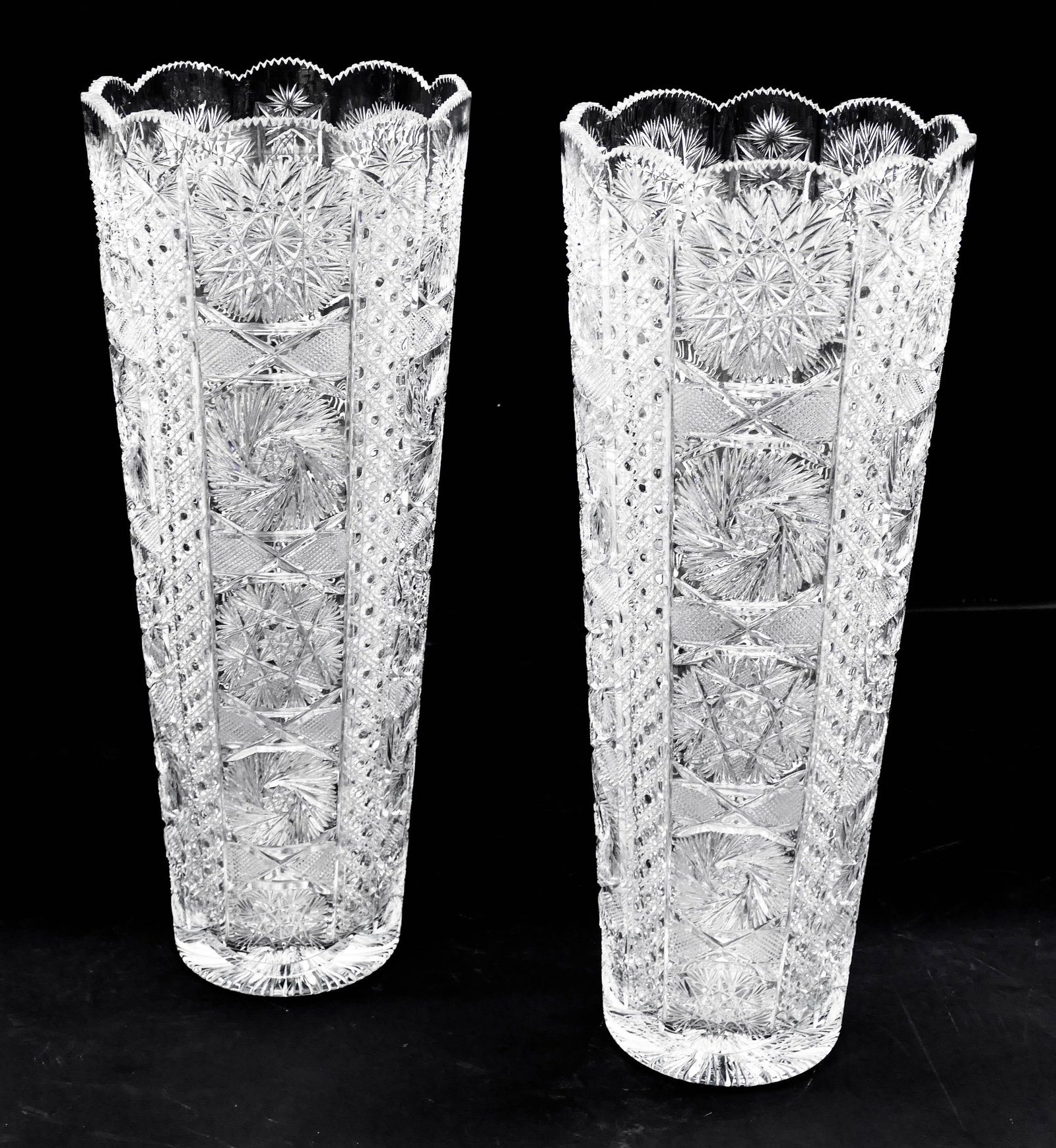 Large Pair of Turkish Brilliant Cut Glass Floor Vases: Large Pair of Turkish Brilliant Cut Glass Floor Vases 24''x9.5'' Each. Impressive pair of diamond and pinwheel cut vases or umbrella stands. Artist signed ''Linna'' at top edge. One has a very slight 