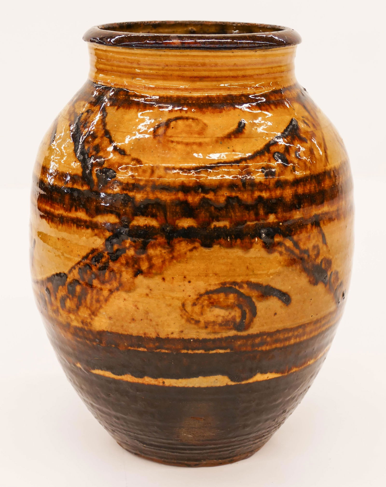 Michael Cardew (1901-1983 British) Winchcombe Jar: Michael Cardew (1901-1983 British) Winchcombe Jar Slipware 10''x7''. Wheel thrown earthenware with slip glaze decoration. Impressed marks on bottom. Some scattered small glaze flaking to top edge and
