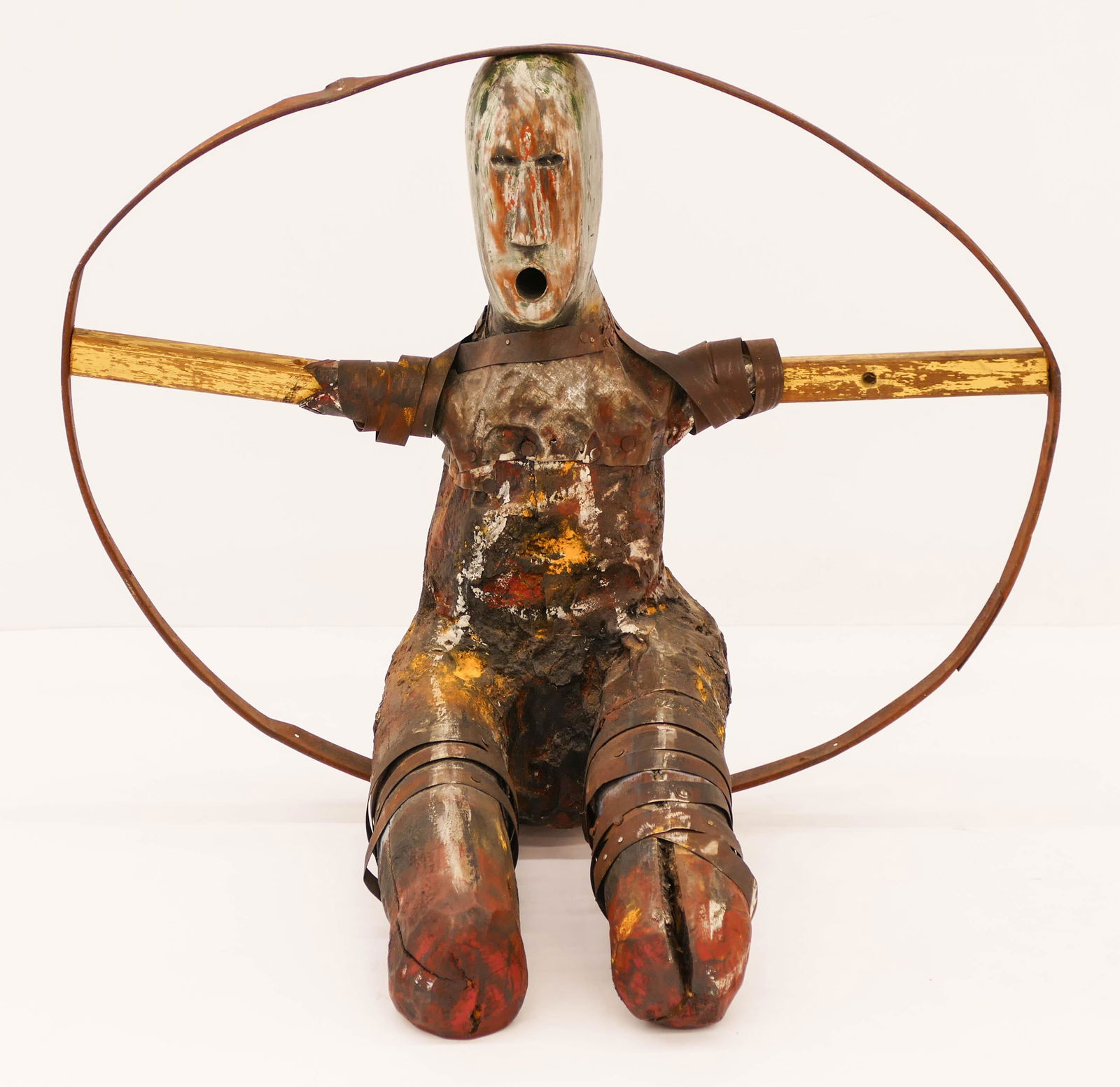 Terry Turrell (b.1946 Washington) ''Propeller'' 1991: Terry Turrell (b.1946 Washington) ''Propeller'' 1991 Mixed Media Sculpture 21''x25''x16''. A seated figure composed of carved wood, metal strapping, nails, and paint. Signed and titled on bottom. Exce