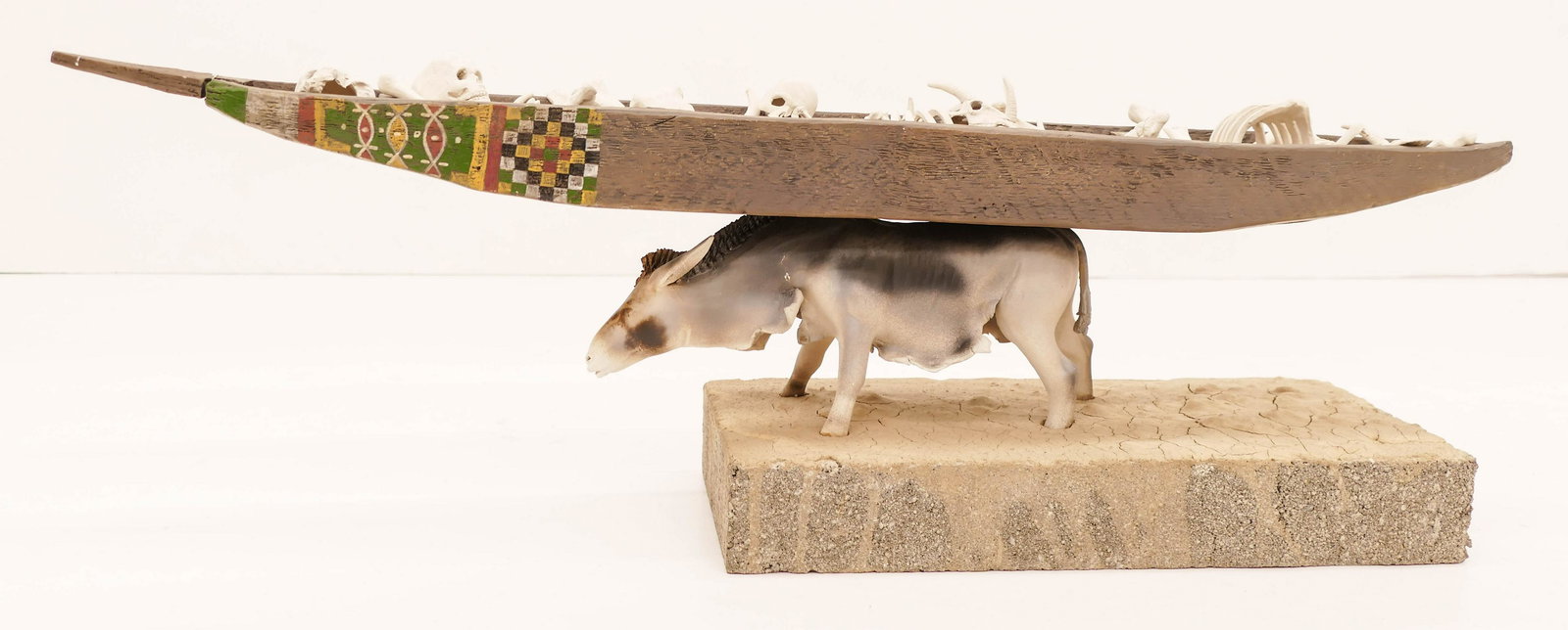 Ronna Neuenschwander (b.1954 Oregon) ''Last Voyage'': Ronna Neuenschwander (b.1954 Oregon) ''Last Voyage'' 1985 Mixed Media Ceramic Sculpture 10''x28''. An assemblage of adobe earthenware with cement base. Signed under figure. Some slight chipping to loo